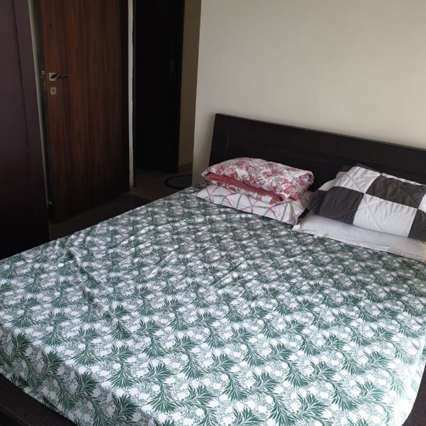 Rent a Comfortable 2BHK Semi-Furnished Flat in Omkar Ananta, Goregaon East - Ideal Living Spaces Await!-1