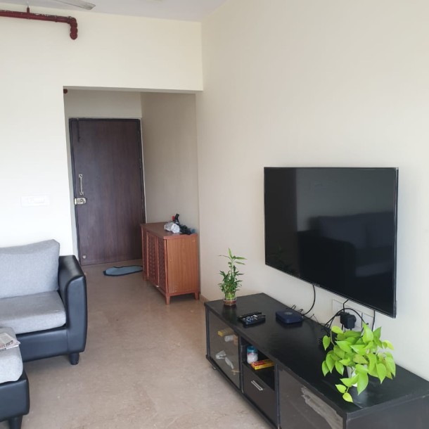 Rent a Comfortable 2BHK Semi-Furnished Flat in Omkar Ananta, Goregaon East - Ideal Living Spaces Await!-4